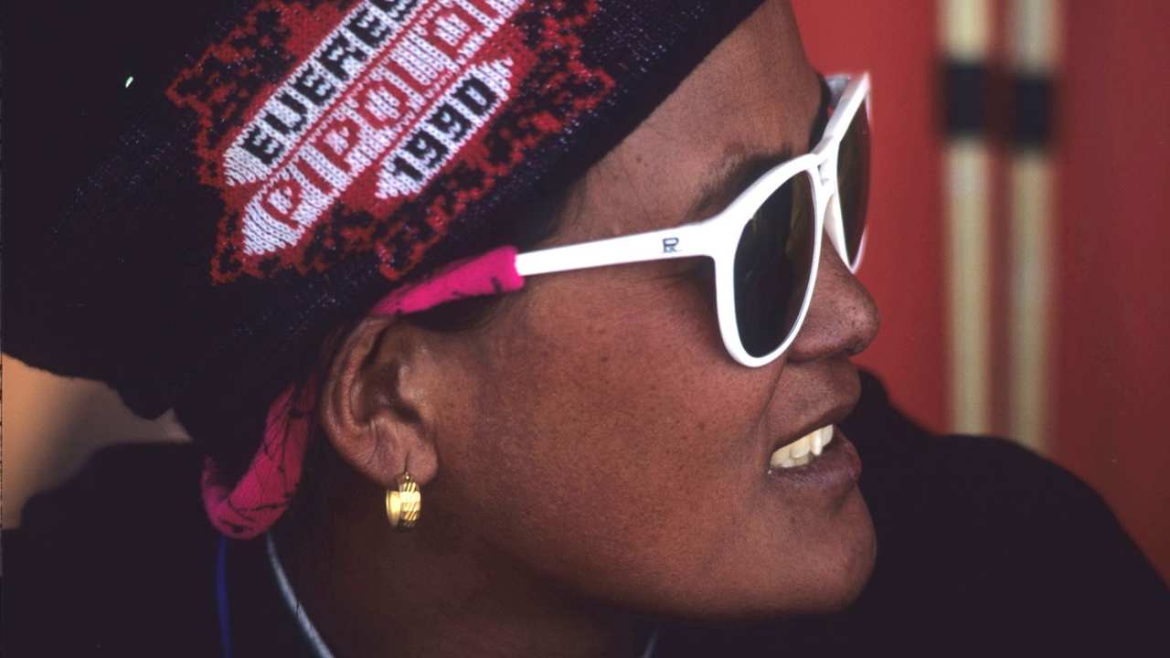 a woman with sunglasses looking to the right