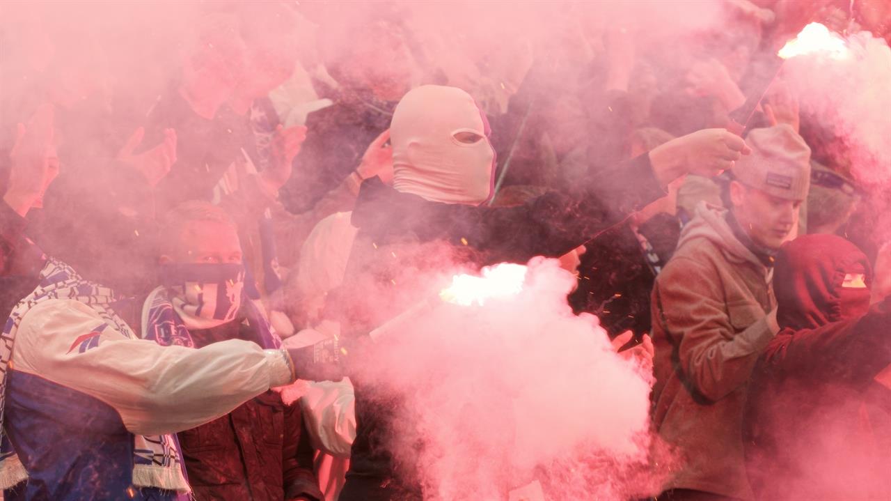 a group of people with smoth and face coverings