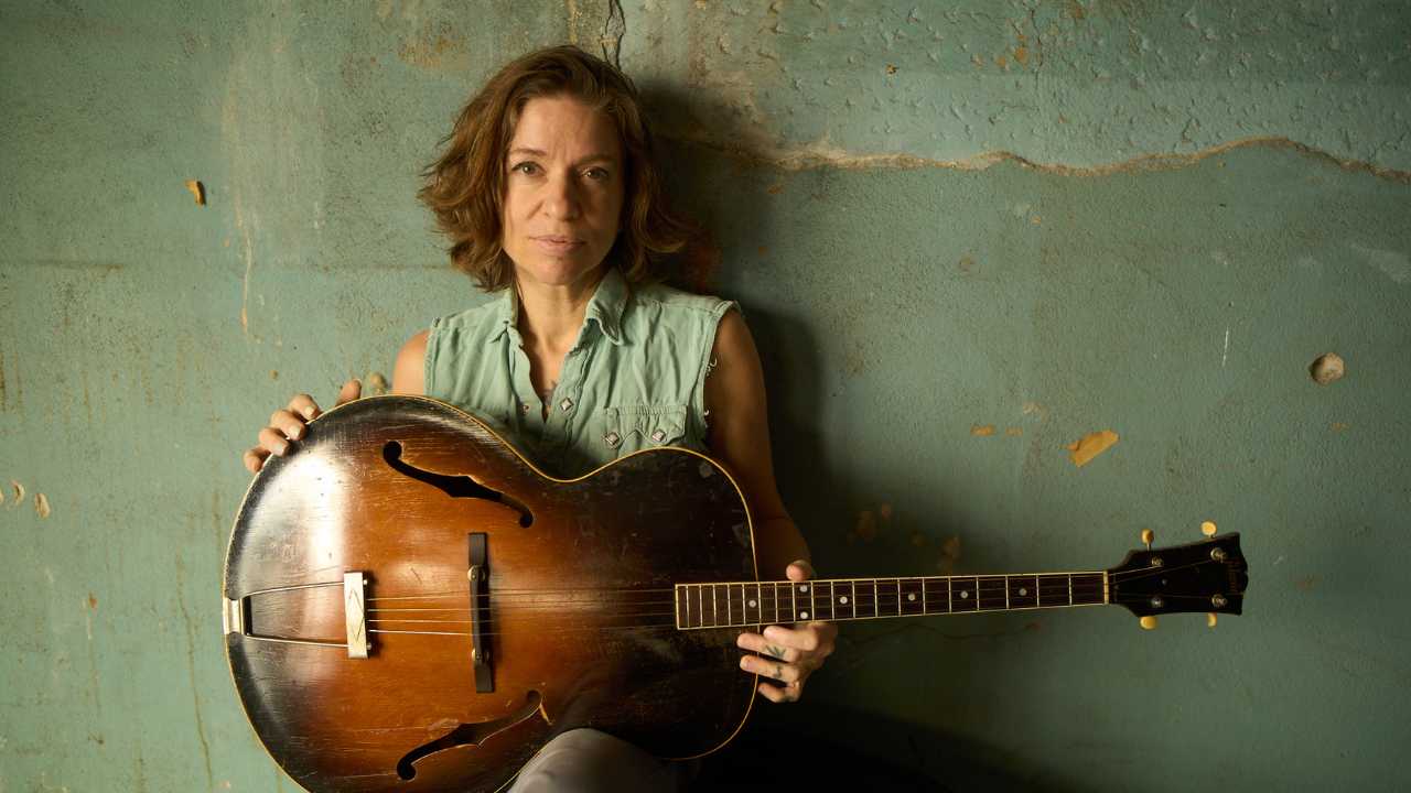 Ani DiFranco with a guitar