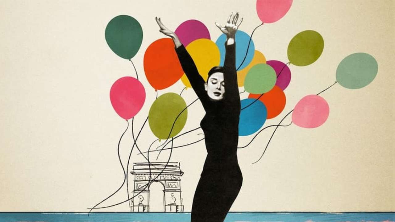 Audrey Hepburn in black in front of balloons