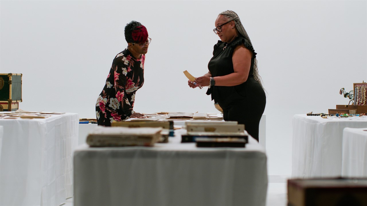 Two women looking at archives