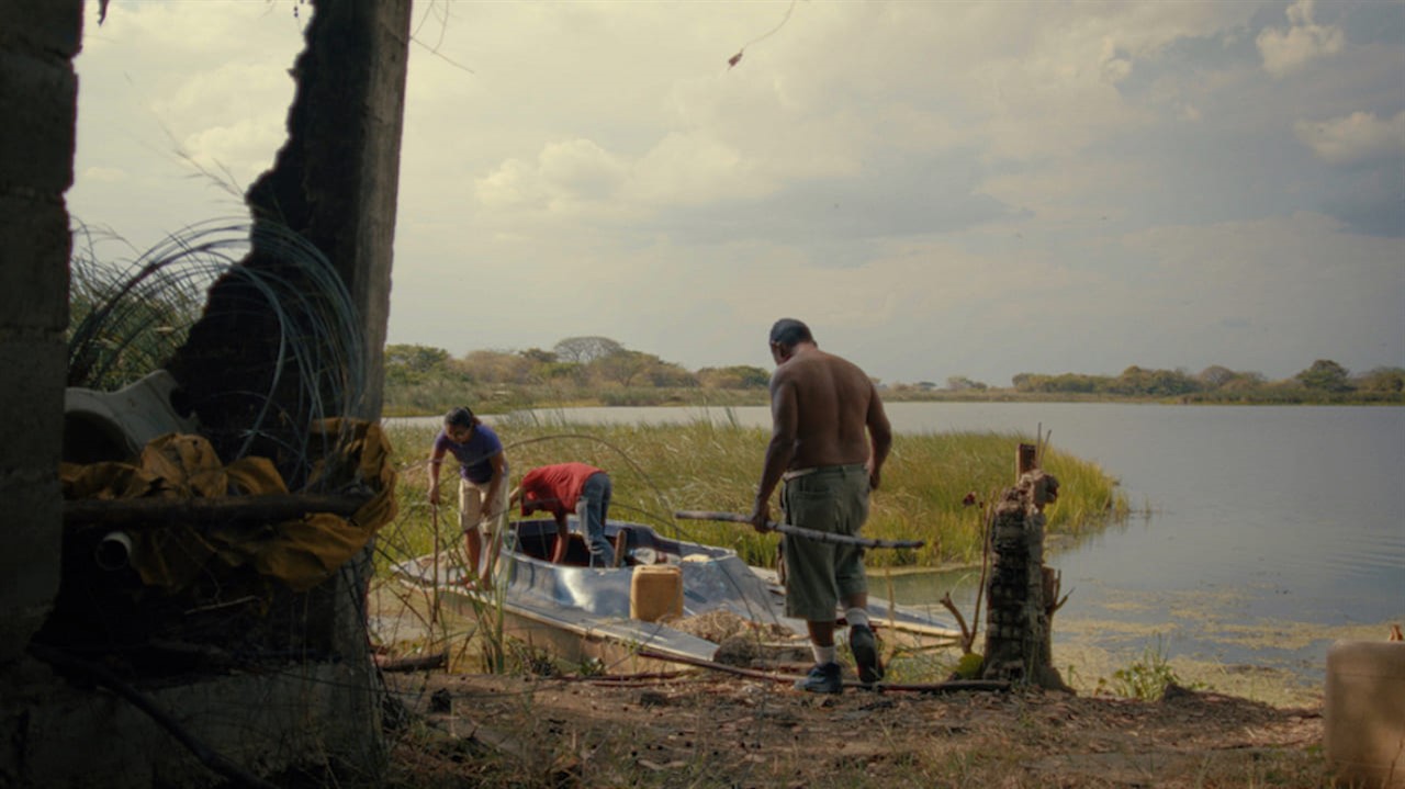 Small group of people preparing a boat for launch