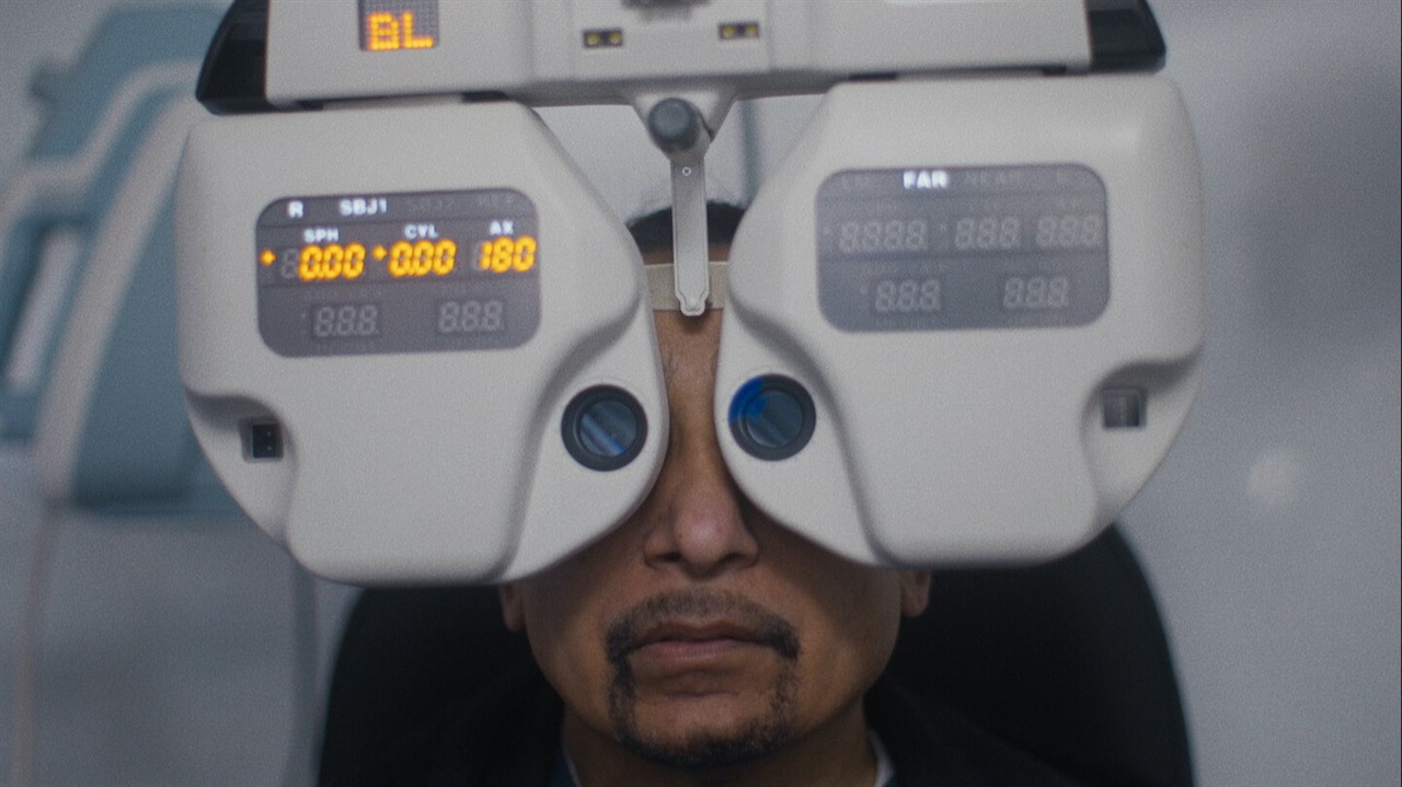 Person looking through optometry equipment