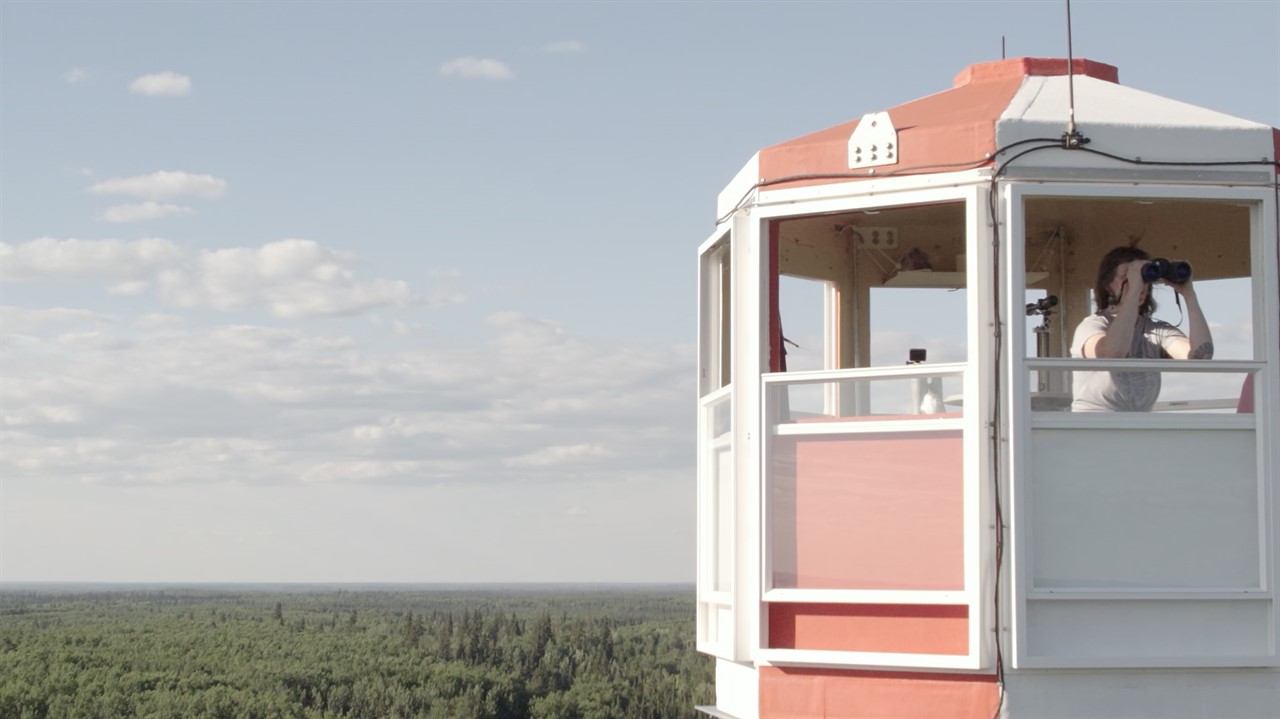 Person in the fire tower with binoculars