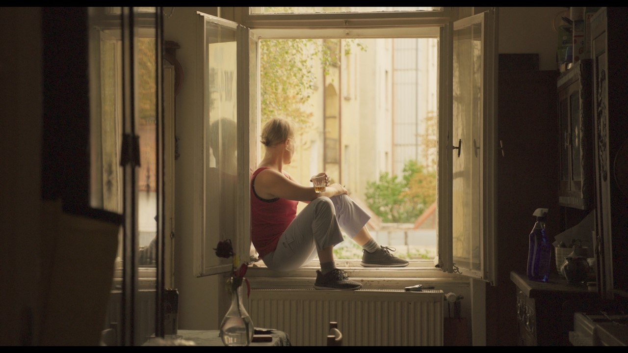Person sitting on a windowsill