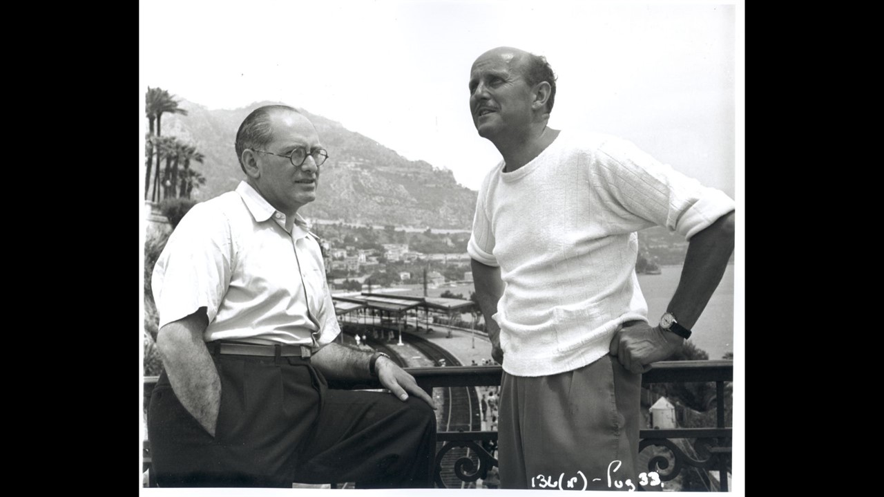Powell and Pressburger stand on a balcony