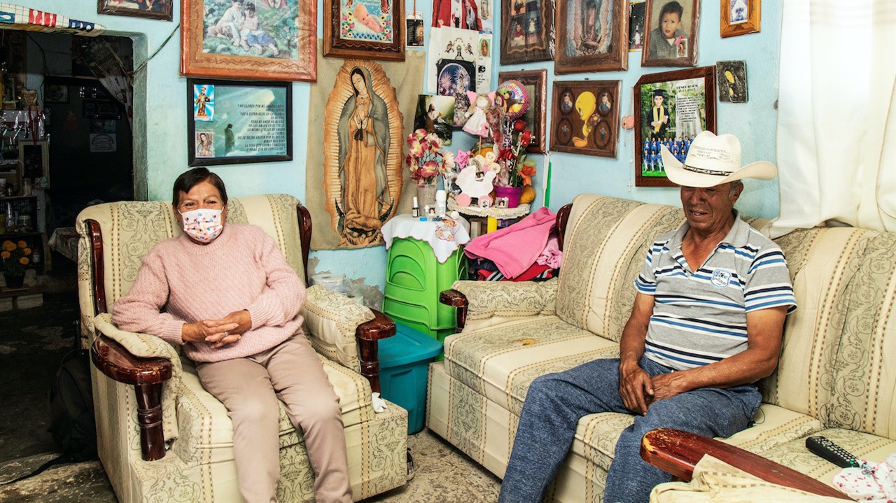 Elderly couple sitting in a livingroom