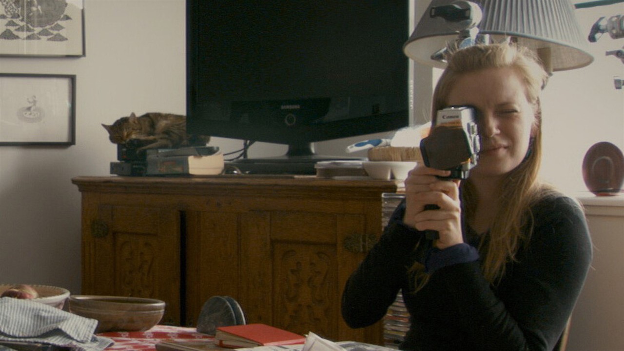 Sarah Polley looking through a camera