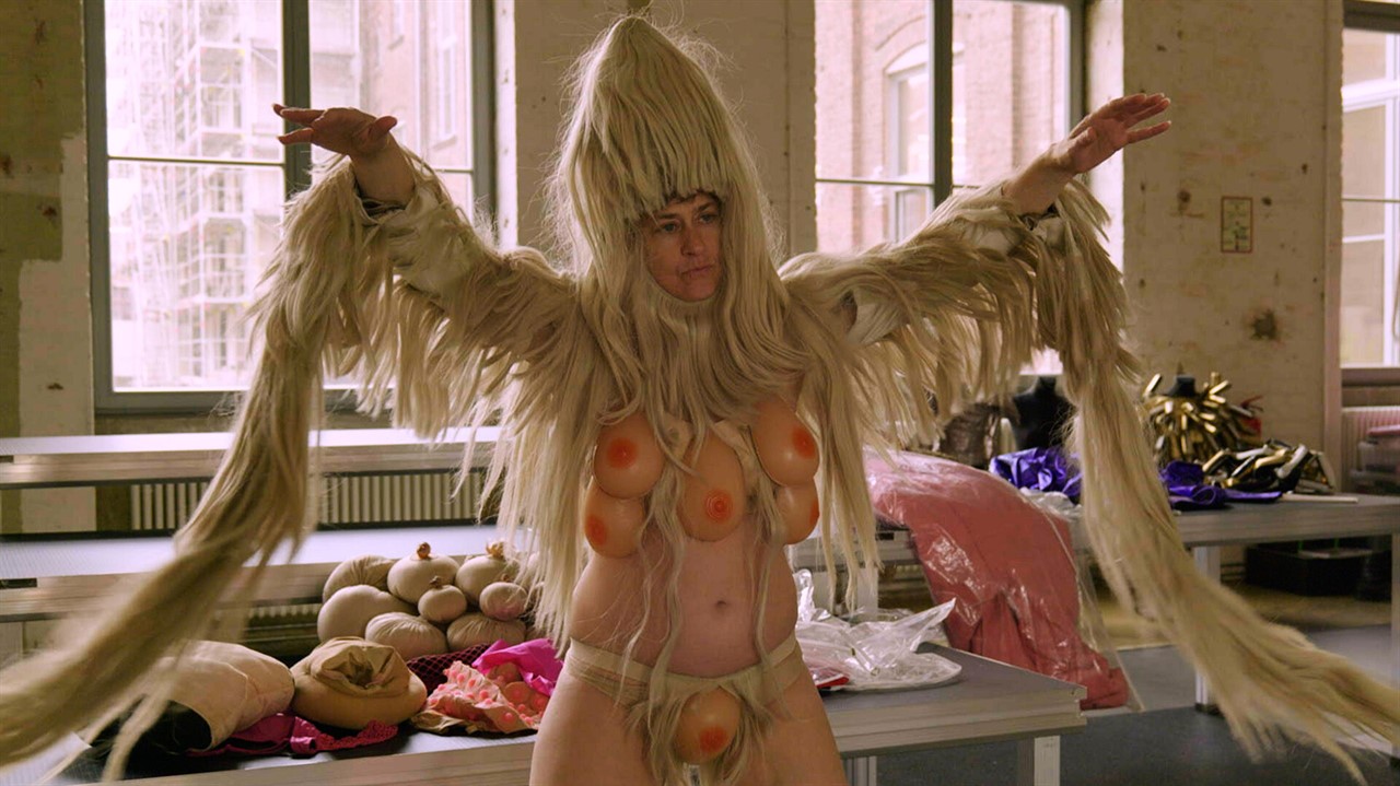 Peaches in a furry costume with plastic breasts
