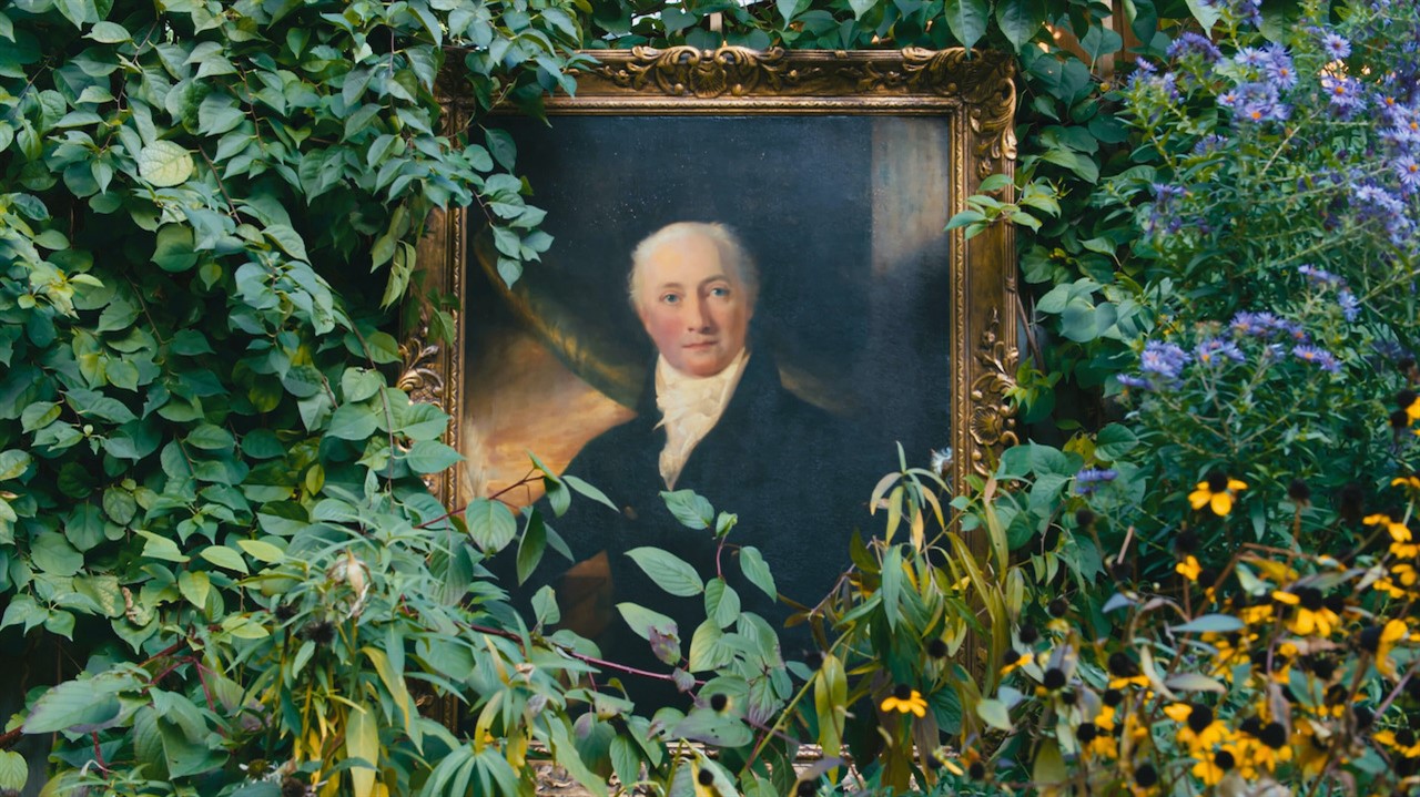 Oil painting surrounded by leaves and flowers