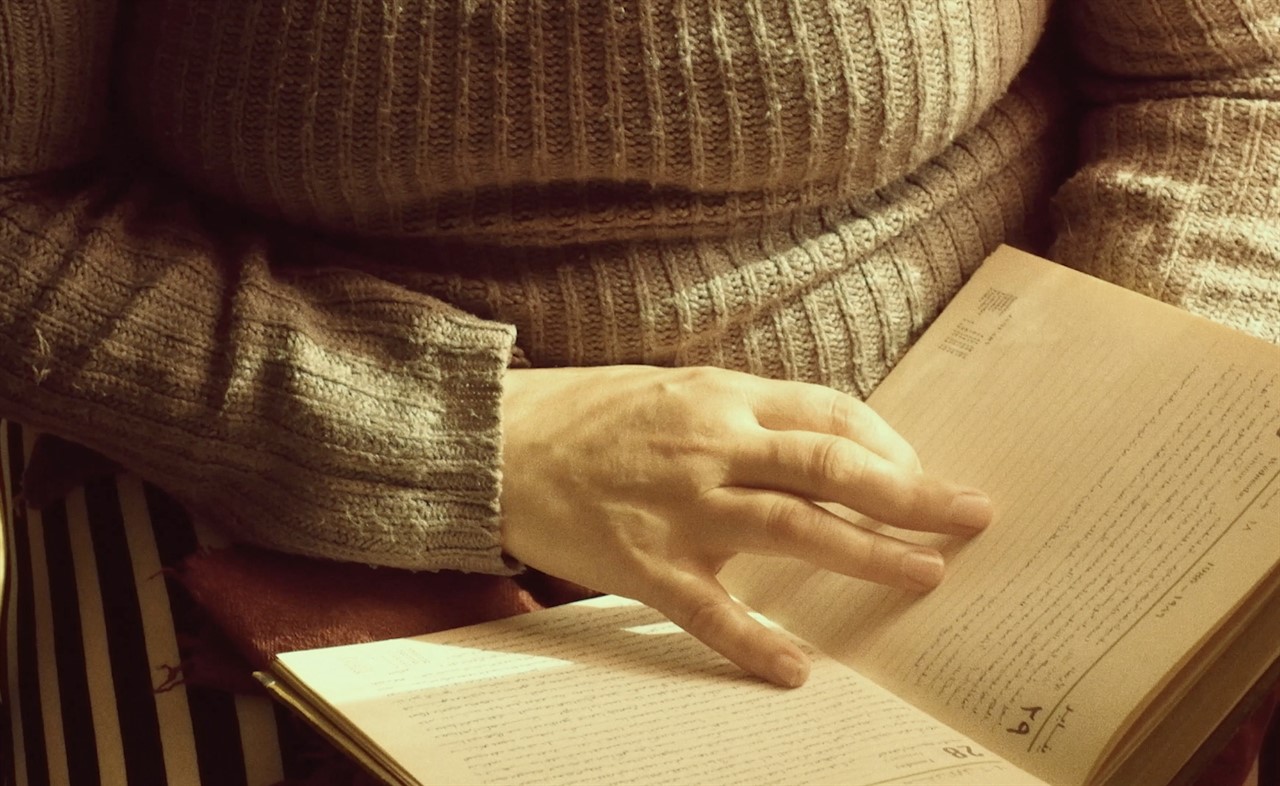 Closeup of a hand on a book