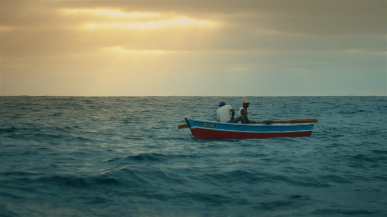 People in a rowboat at sea