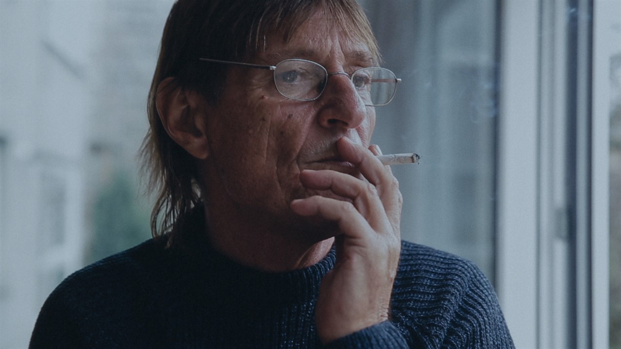 Closeup of an older man smoking a cigarette