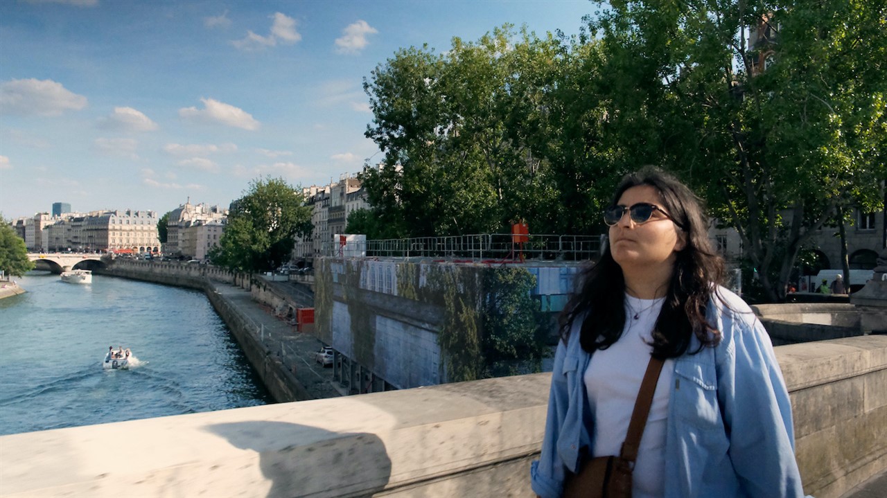 Woman walking over a bridge