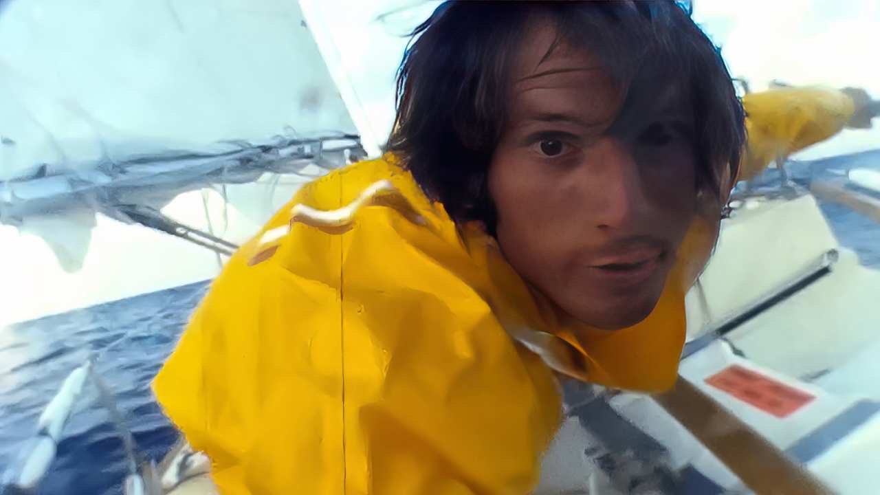 a man with longer hair on a boat