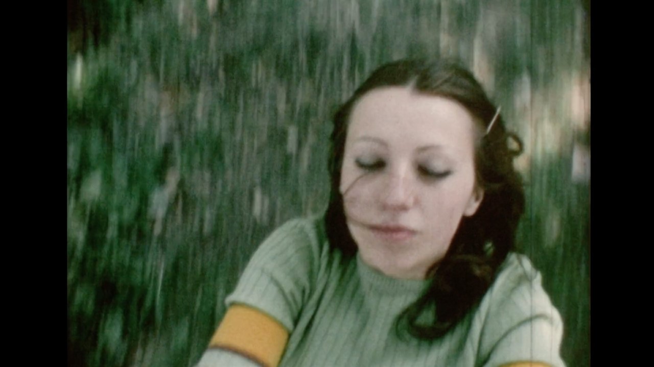 Blurred image of a woman with her eyes closed