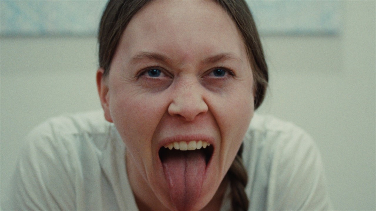 A woman sticking out her tongue.