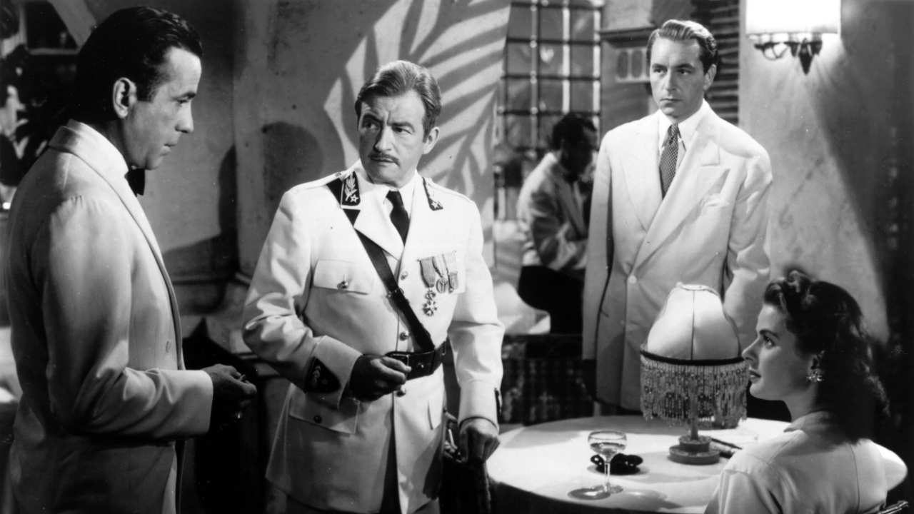 three men and a woman talking