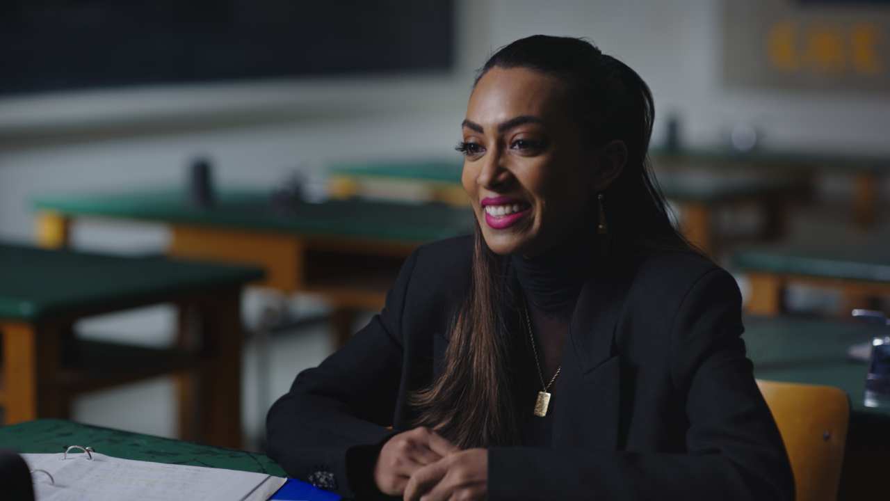 Melinda Shankar looking to the left and smiling