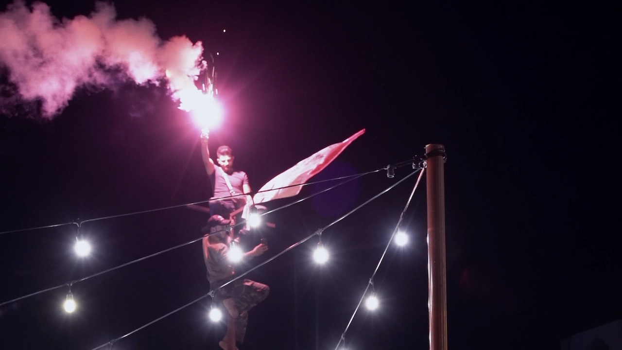 Person on a pole with a flare