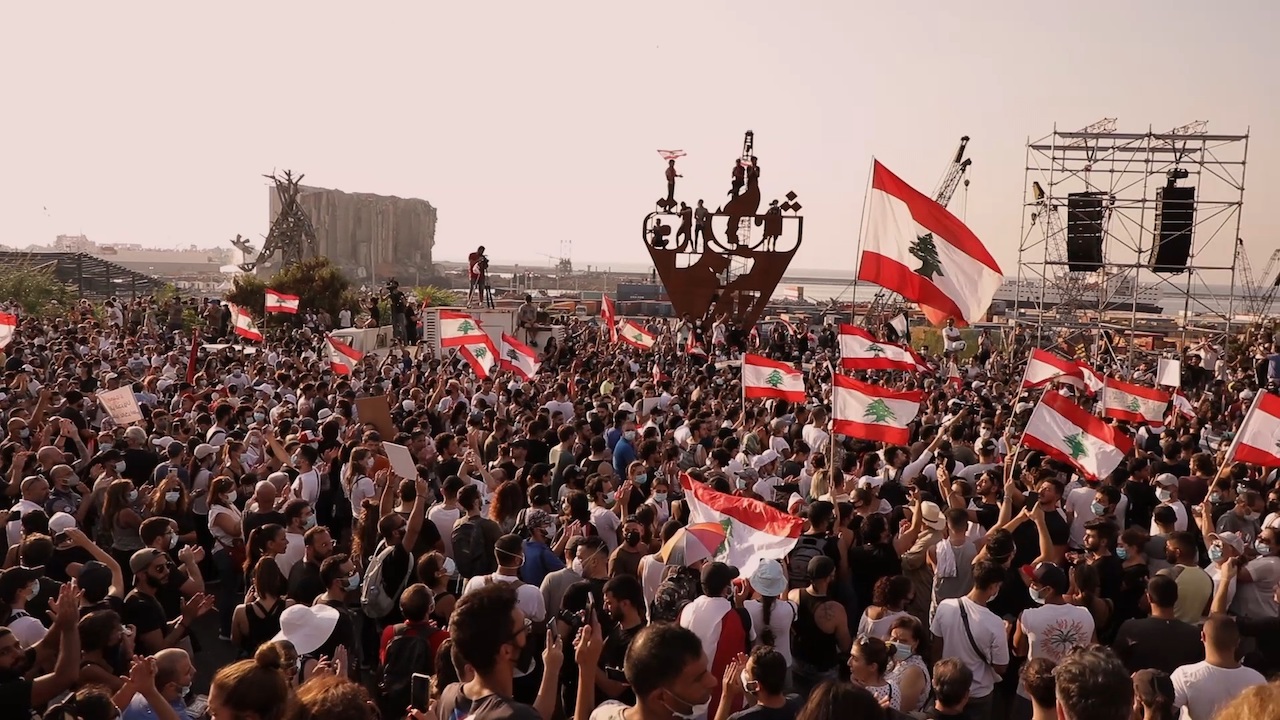 Large crowd of protesters with Lebanese flags