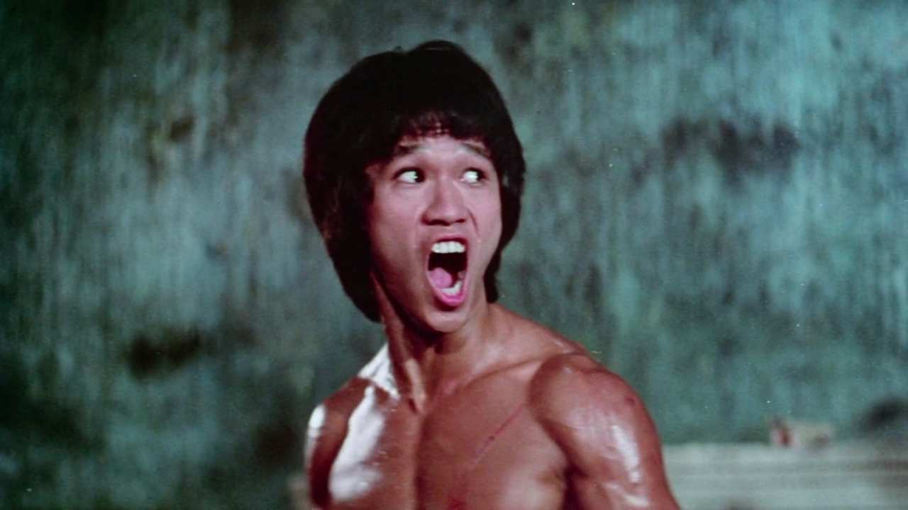 a shirtless man yelling