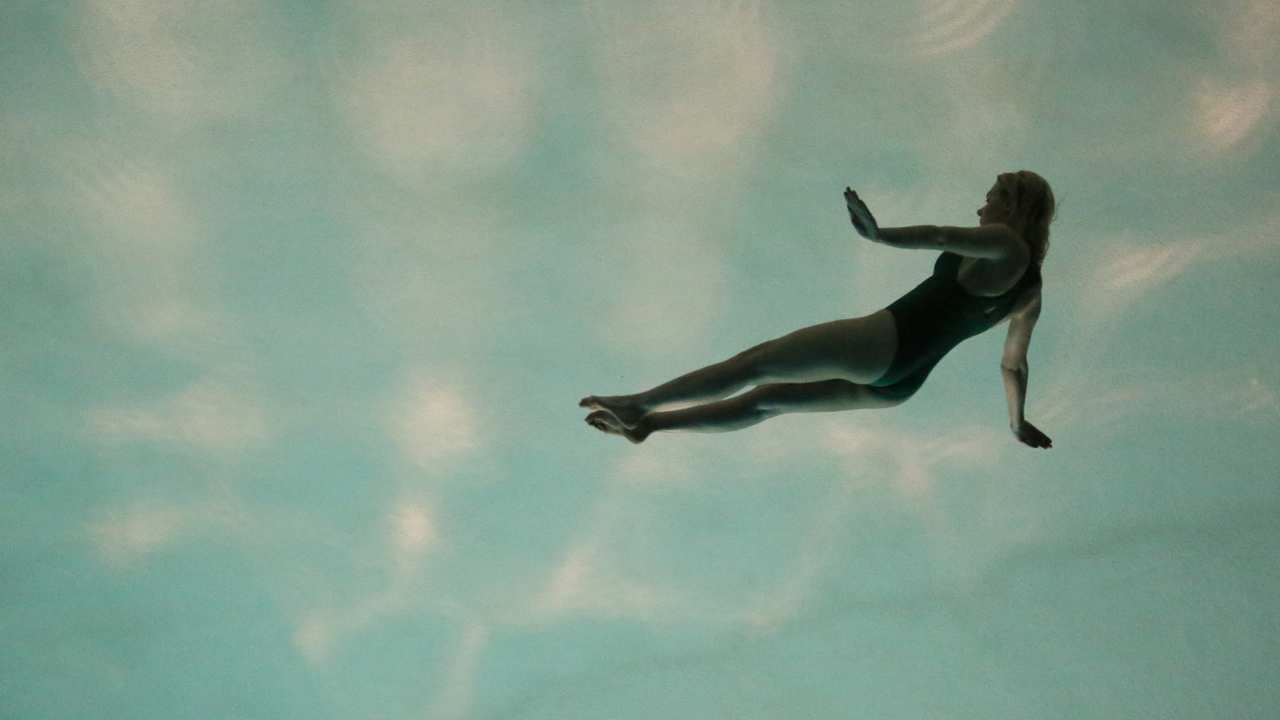 a woman swimming in the air