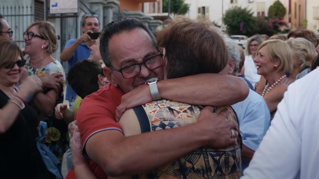 People hugging in a crowd