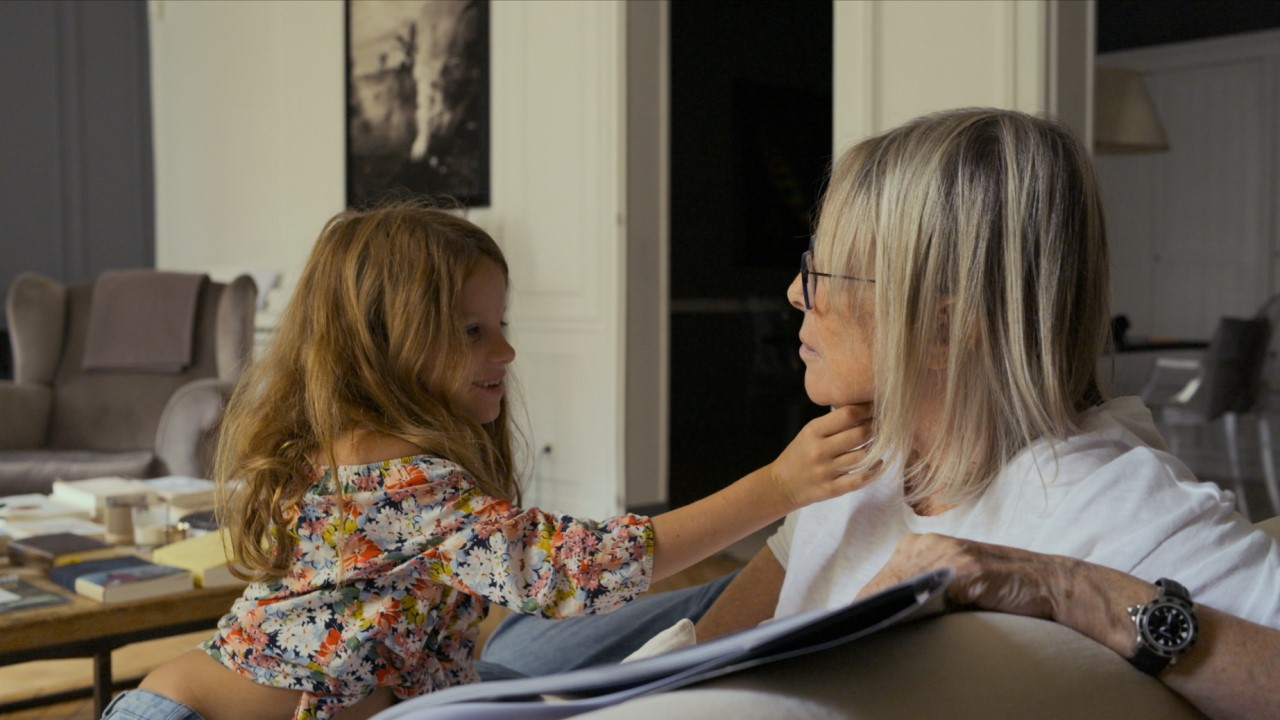 Kid touches adult's chin