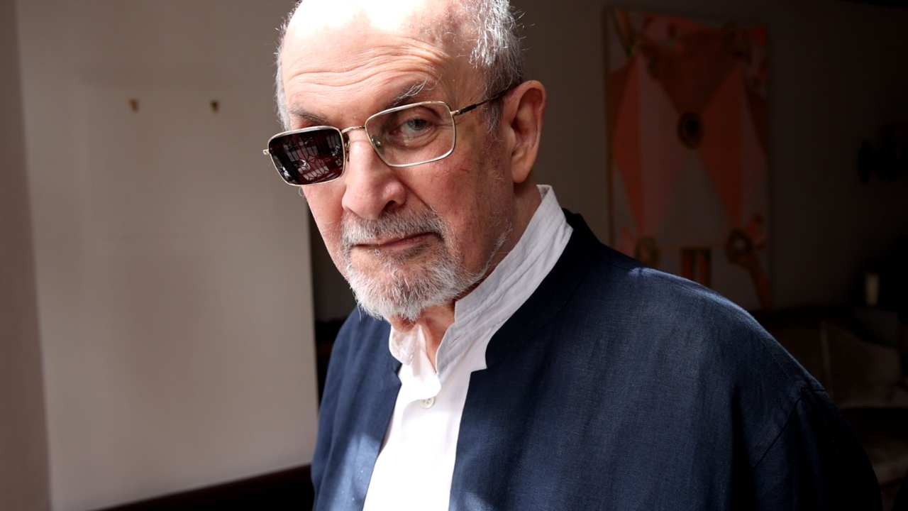 Salman Rushdie looking at the camera
