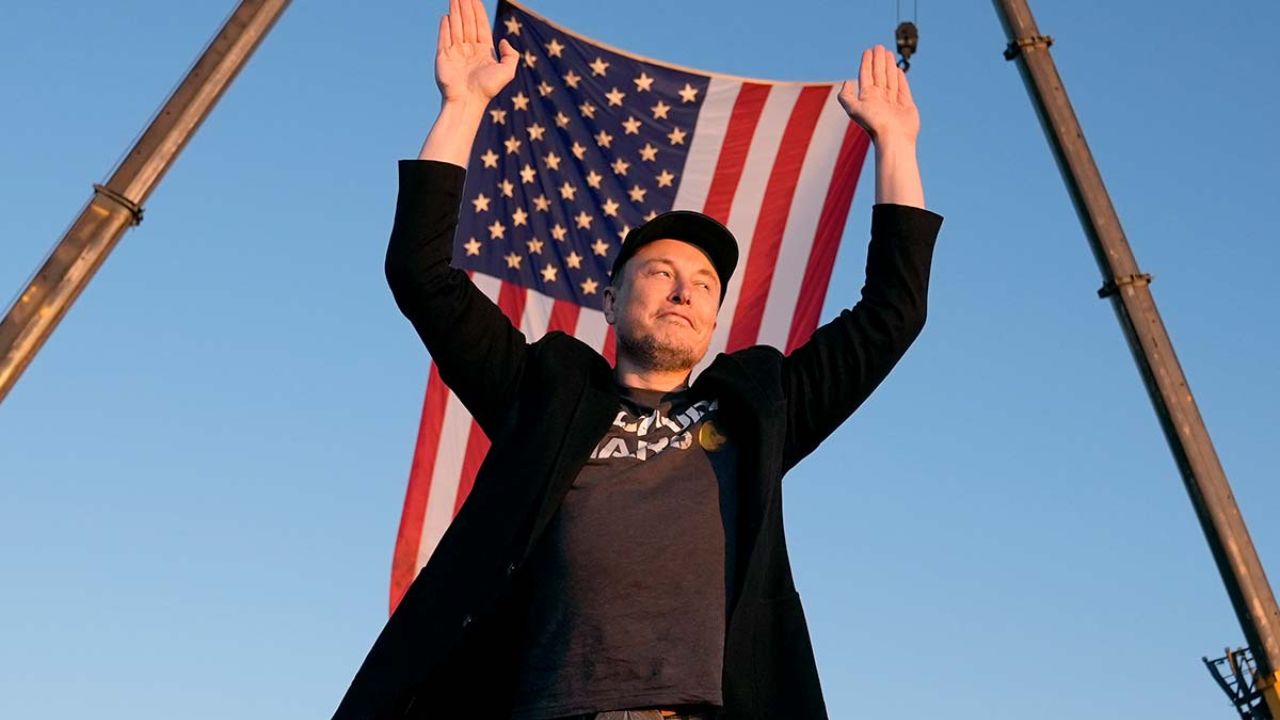 Elon Musk holding a US flag