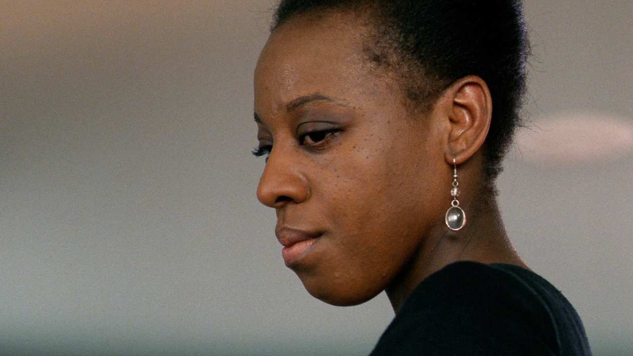 closeup of a woman's side profile with earrings