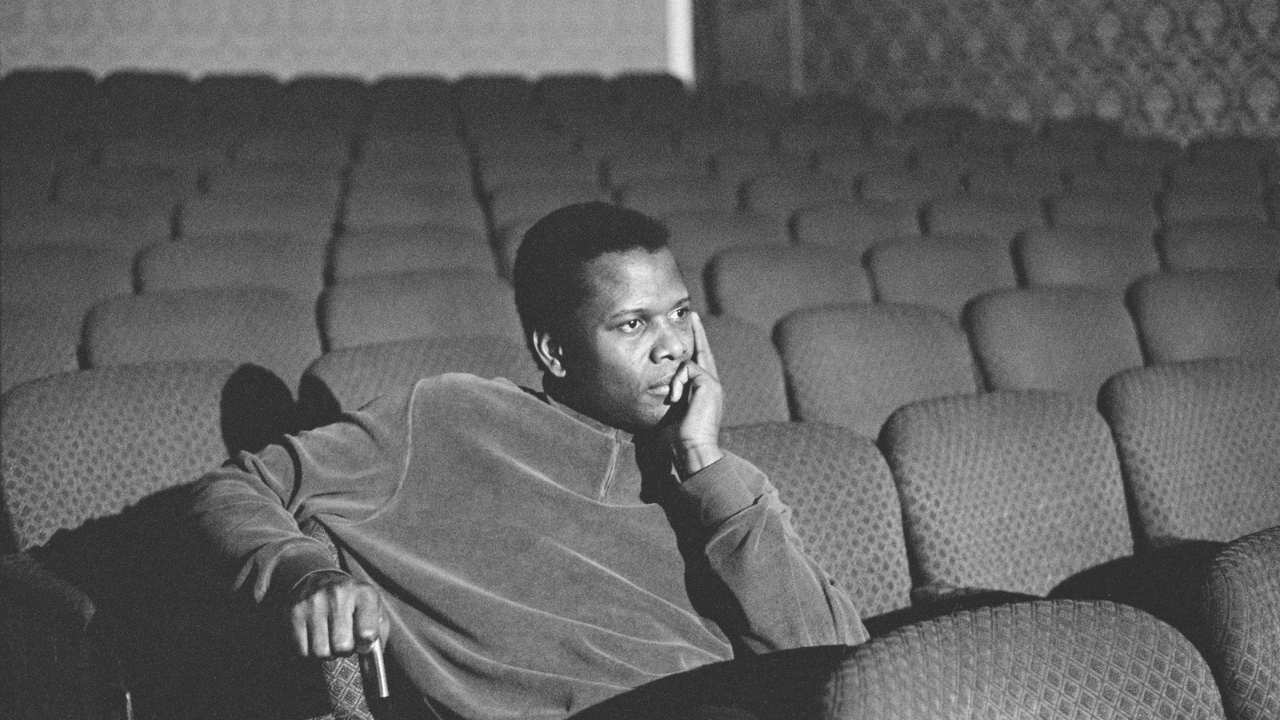a man sitting in a theatre