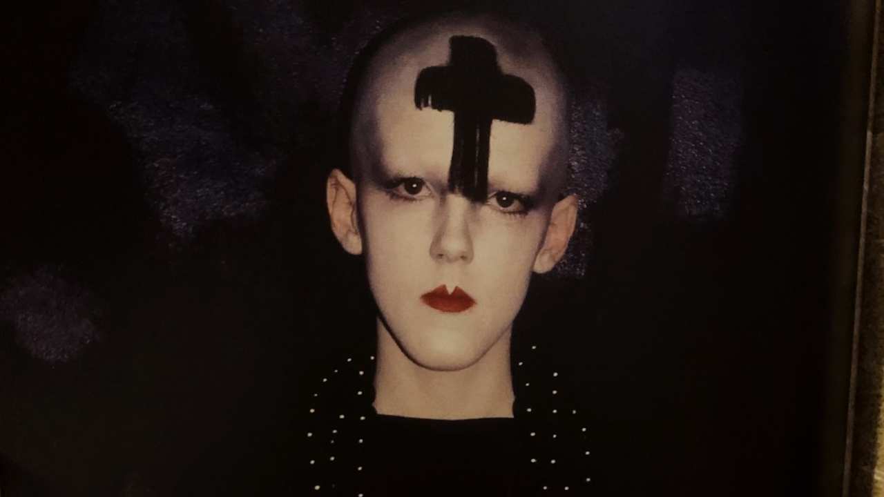 a person with a cross on their forehead