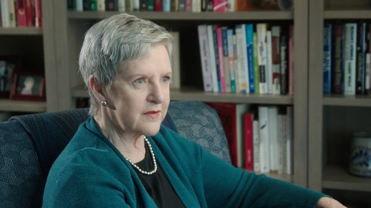 Older white woman with peal necklace