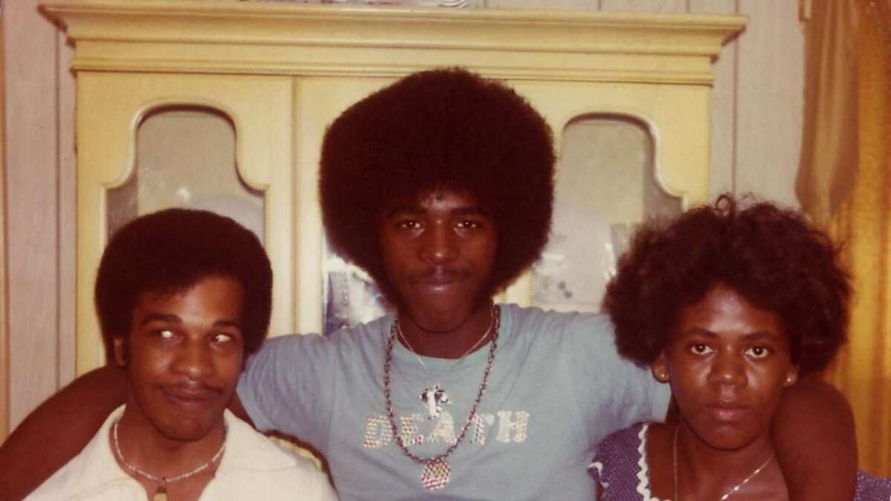 three people posing for a photo