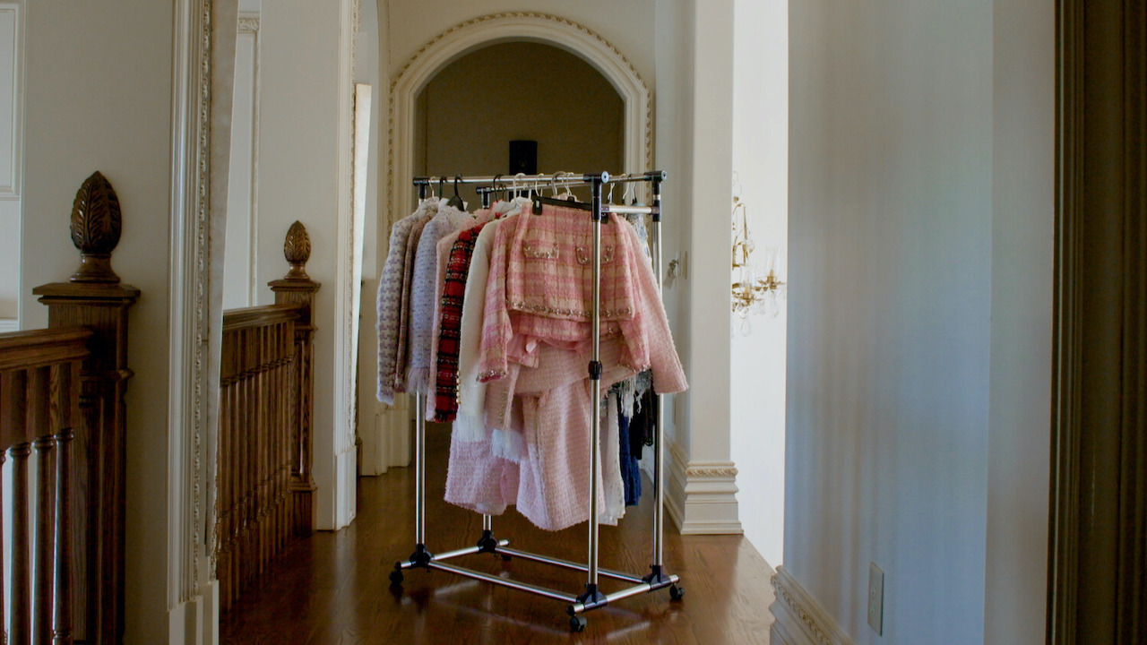 Rack of clothing in a hallway