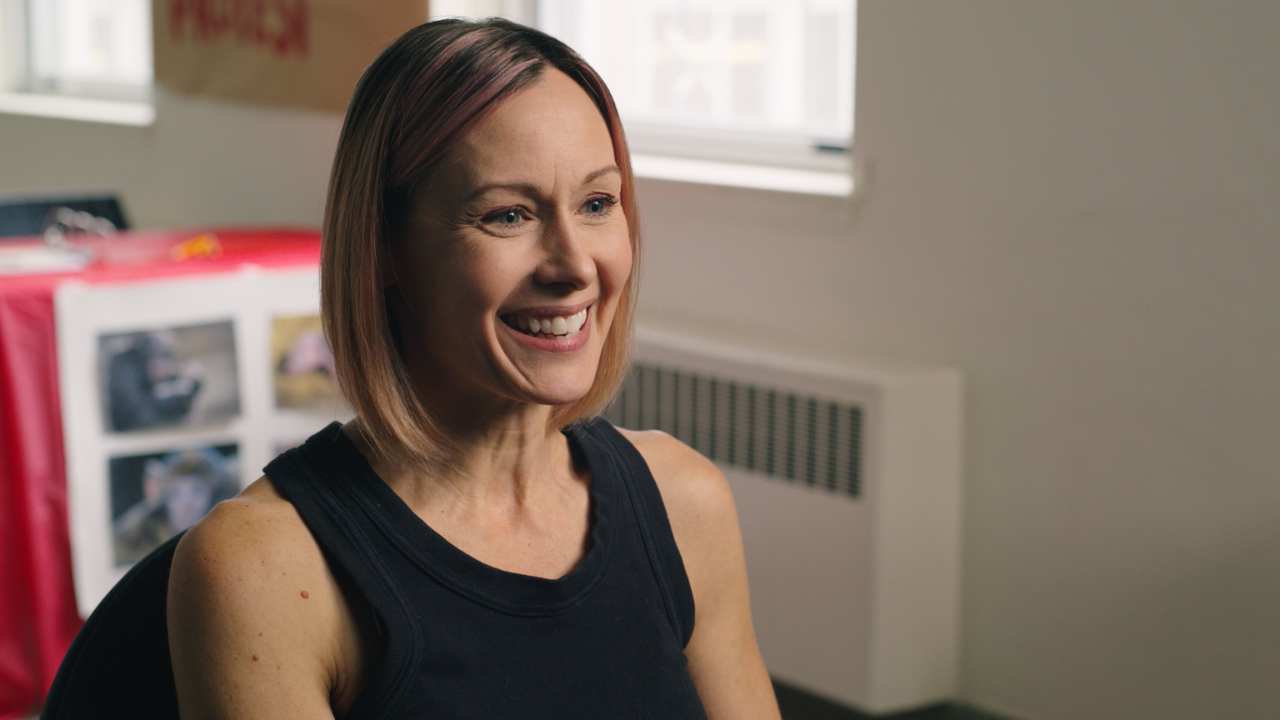 Stacie Mistysyn sitting and smiling