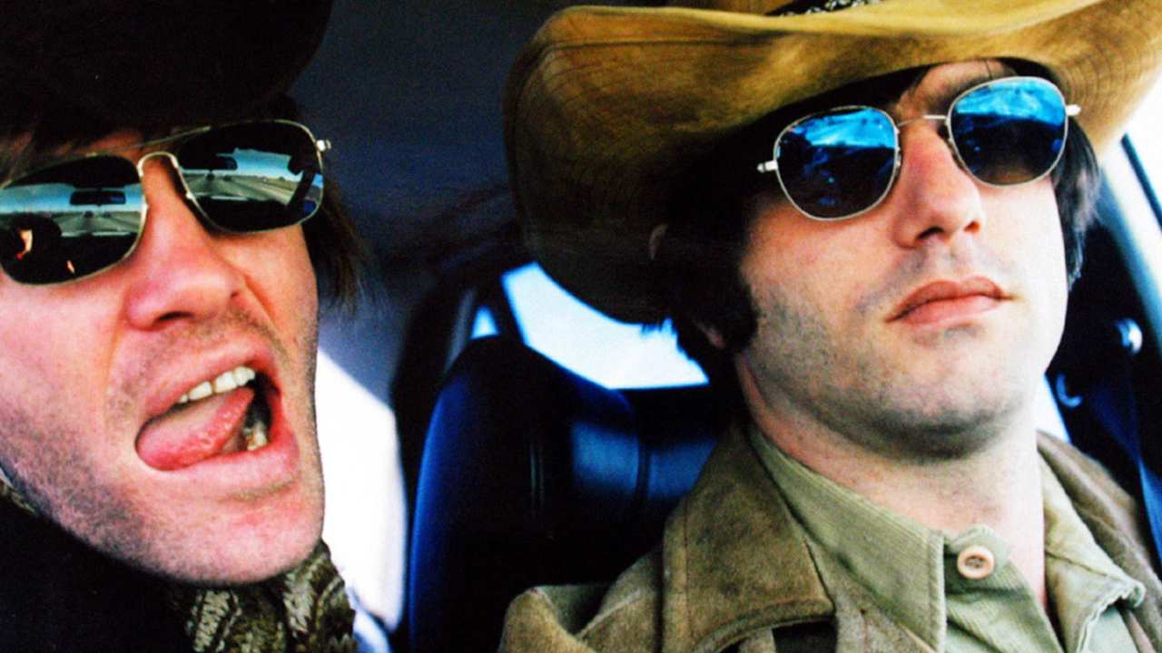 two men with sunglasses in a car