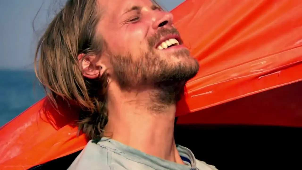 side profile of a bearded man with long hair