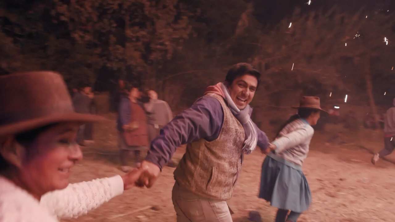 a man smiling holding hands with 2 women