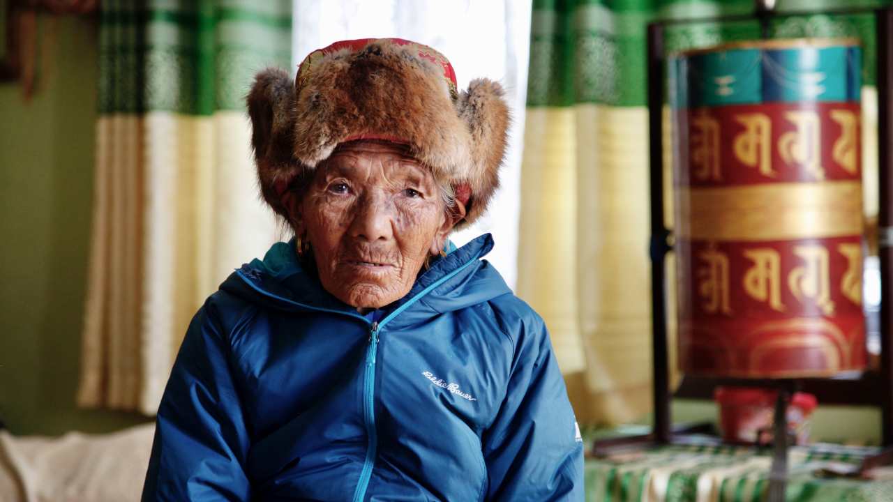 person with a fur hat looking at the camera