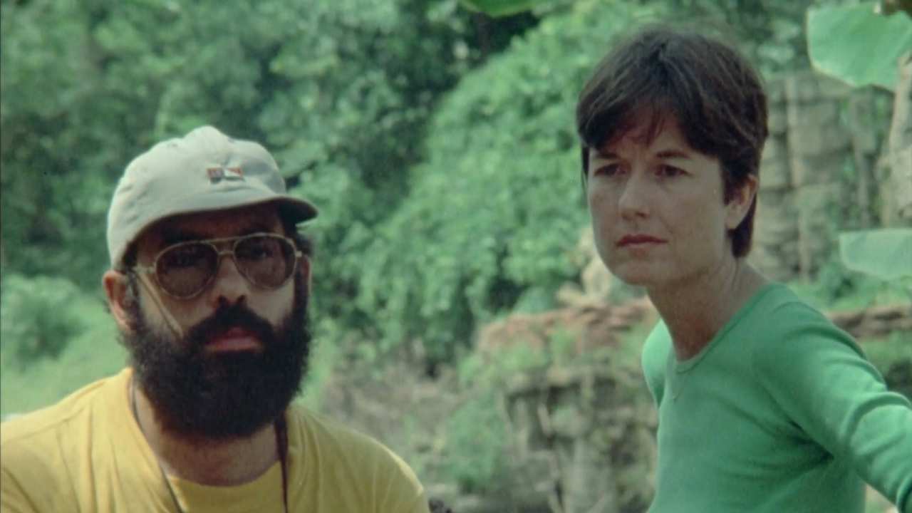 a man with a beard standing with a woman