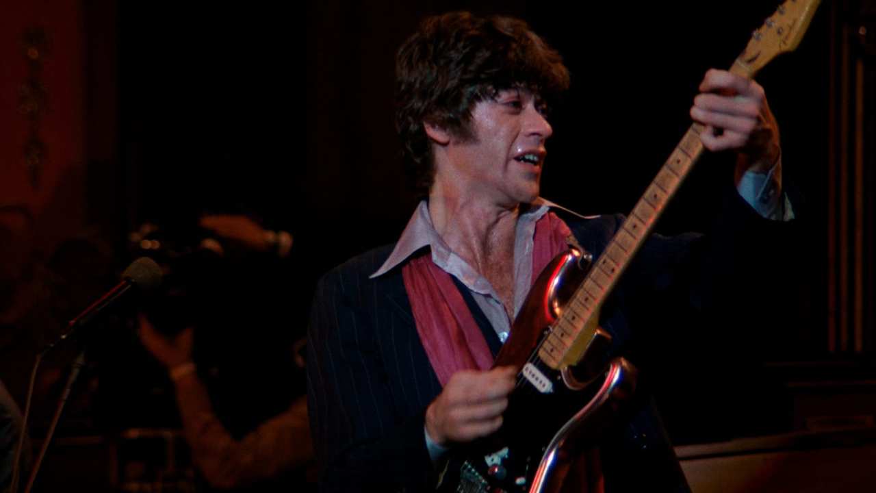 a man playing a guitar