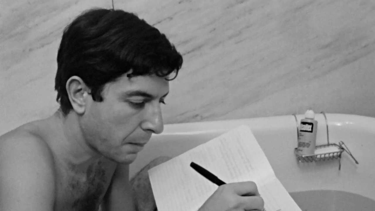 Leonard Cohen writing in a bath tub