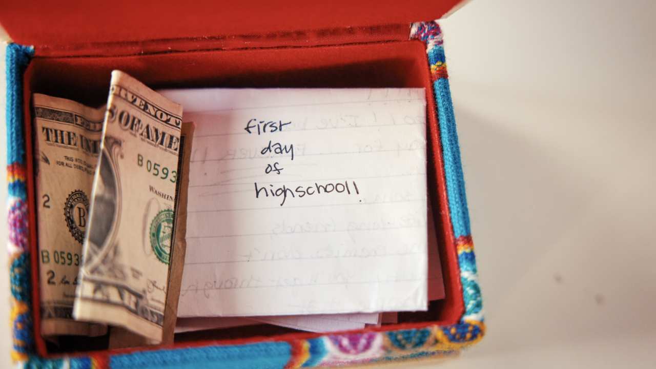 a box with money and a handwritten note