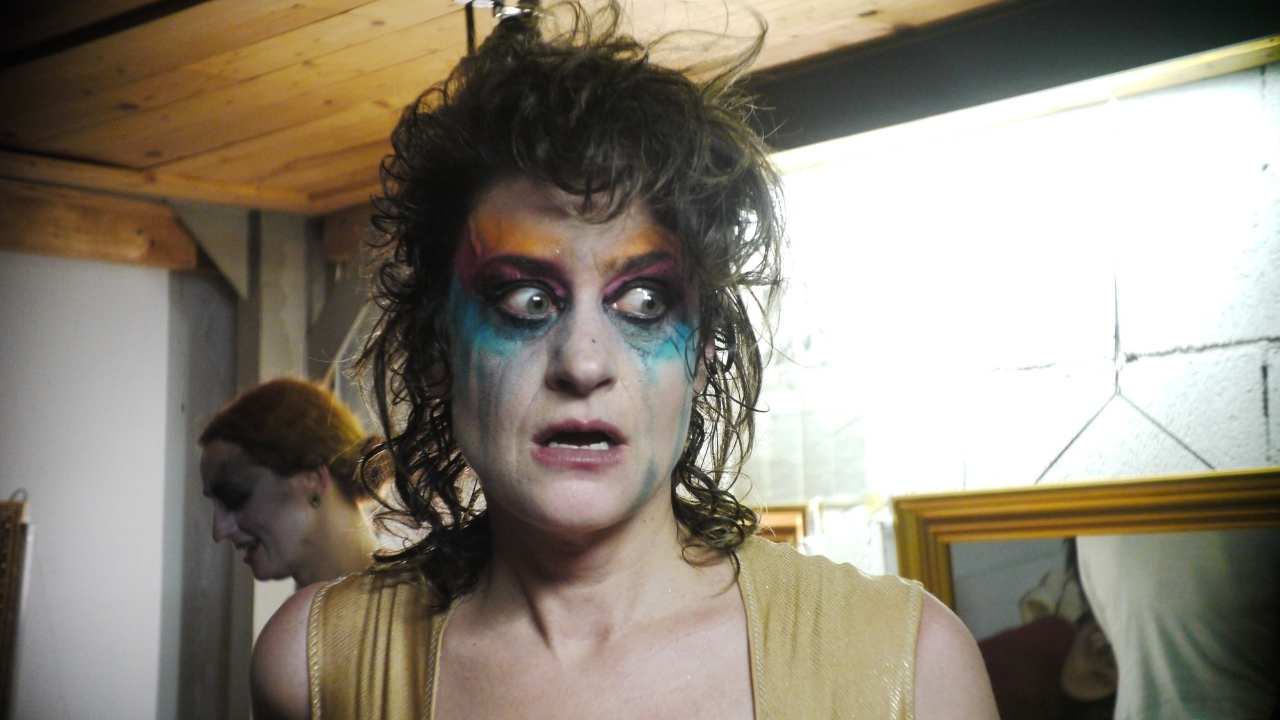 Peaches with heavy makeup looking surprised