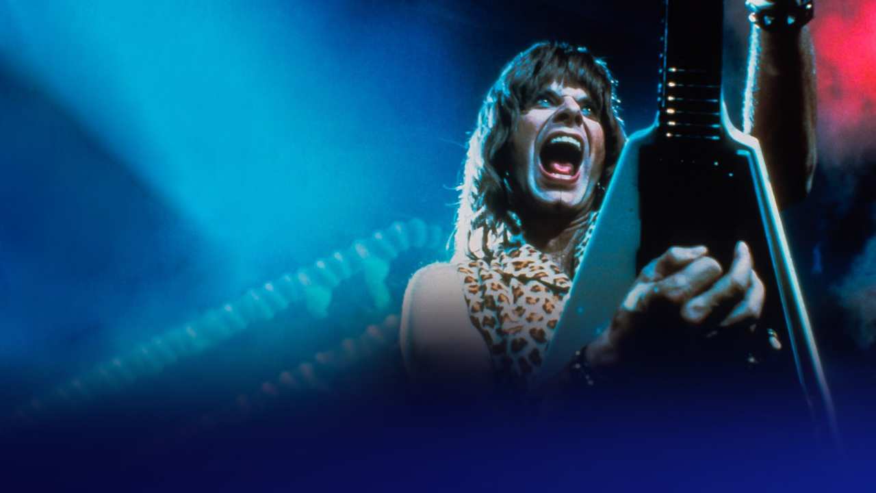 a man in leopard playing a guitar