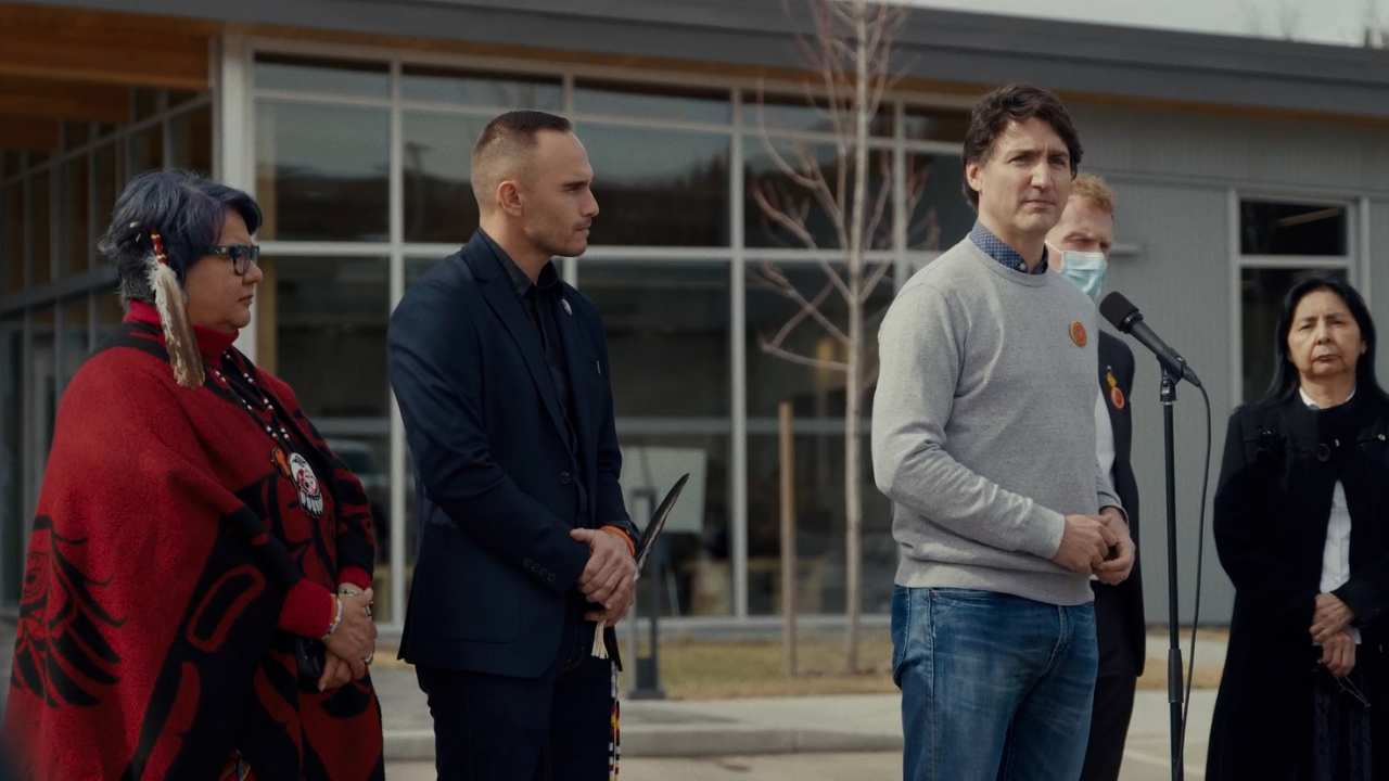 Prime Minister Trudeau standing with 4 people