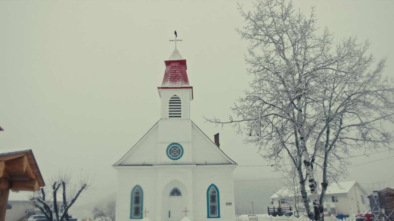 a church surrounded by snow